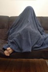 hiding under blanket